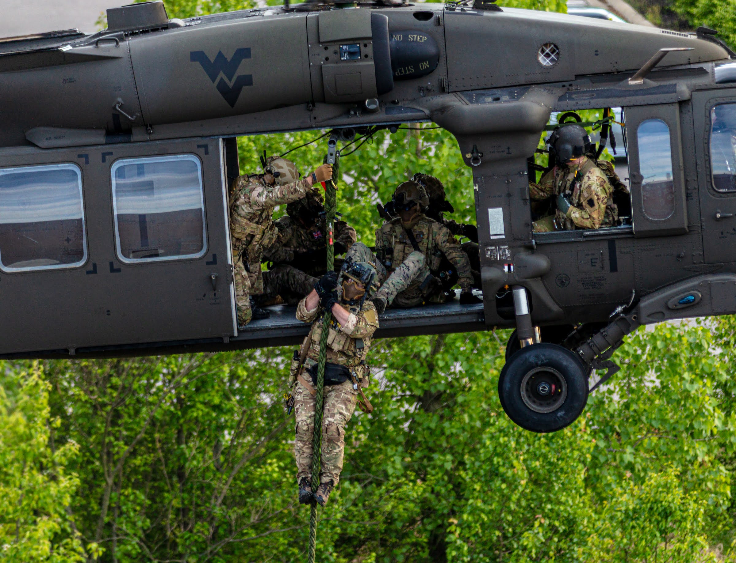 A helicopter and people photographed outdoors